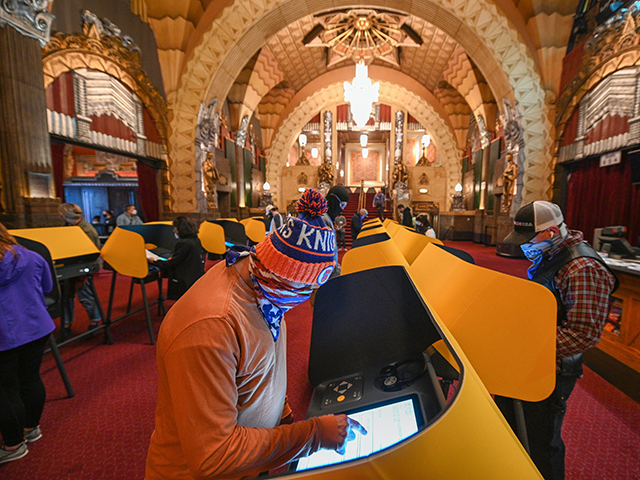 Voters casts their ballots at the Pantages Theatre polling station on November 3, 2020 in