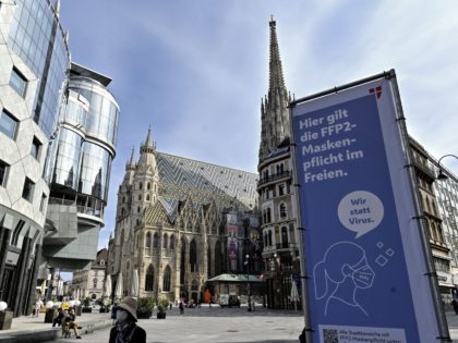 A sign standing at Stephansplatz square in Vienna, Austria, indicates that wearing FFP2 fa