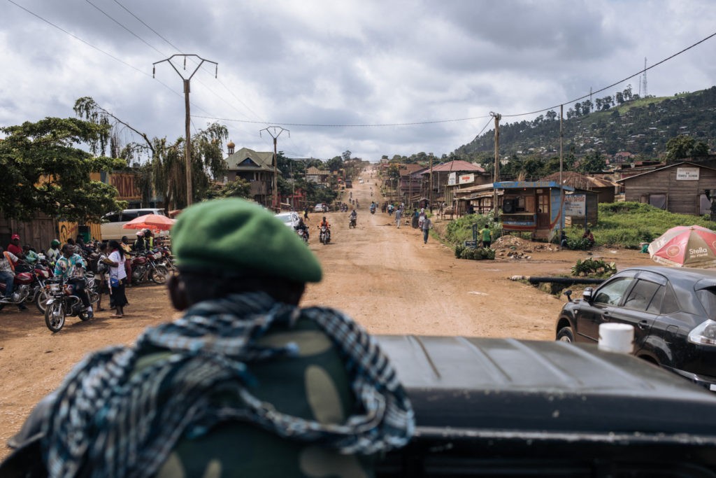 Congolese soldiers drive along the road from Beni to the Ugandan border, 80 kilometers east, northeastern Democratic Republic of Congo, on May 23, 2021. - Since December 2020, several dozen deadly attacks have taken place on this road and in surrounding villages. Since October 2019 and the launch of "large-scale" military operations in Beni Territory, the armed group Allied Democratic Forces (ADF), originally from Uganda and claiming to be a branch of the Islamic State organization, has increased its deadly attacks and killed over 1,200 people. In March 2021, the U.S. State Department listed the ADF as an international terrorist organization affiliated with ISIS, and designated it as ISIS-DRC. (Photo by ALEXIS HUGUET / AFP) (Photo by ALEXIS HUGUET/AFP via Getty Images)