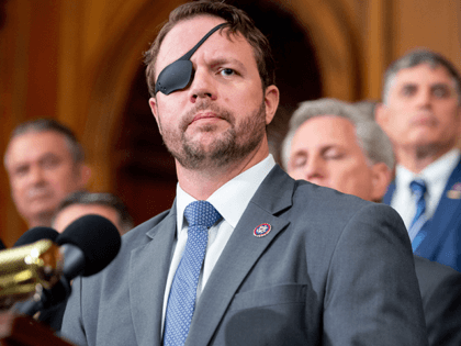 US Representative Dan Crenshaw (L), Republican of Texas, speaks alongside fellow Republicans about the US military withdrawal from Afghanistan, criticizing US President Joe Biden's actions, during a press conference at the US Capitol in Washington, DC August 31, 2021. (Photo by SAUL LOEB / AFP) (Photo by SAUL LOEB/AFP via …