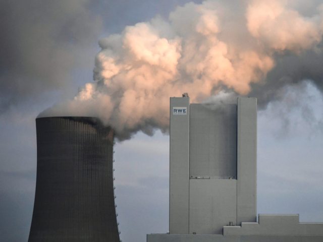 Steam rises from the cooling towers of the lignite-fired power plant of German energy giant RWE in Neurath, western Germany, on January 17, 2022. (Photo by Ina FASSBENDER / AFP) (Photo by INA FASSBENDER/AFP via Getty Images)