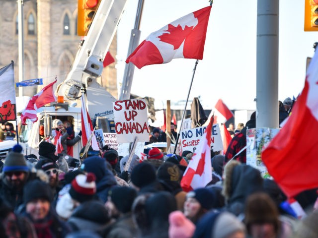 OTTAWA, ON - FEBRUARY 05: Protesters near Parliament Hill hold signs condemning the vaccin