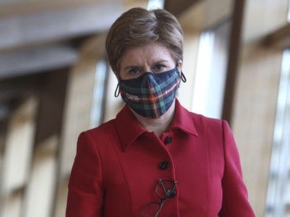 ENDINBURGH, SCOTLAND - FENRUARY 08: MSP First Minister Nicola Sturgeon wearing a face mask attends the Scottish Parliament for updates to MSPs on any changes to the Covid restrictions atScottish Parliament Holyrood on February 8, 2022 in Edinburgh, Scotland. (Photo by Fraser Bremner - Pool/Getty Images)