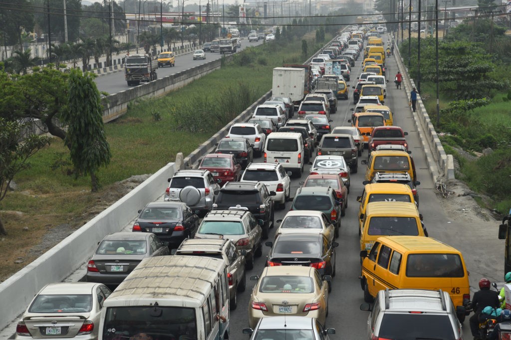 Motorist queue to buy fuel in short supply resulting in traffic gridlock following the discovery of contaminated fuel in supply in filling stations across the country, especially in Lagos, Nigeria's commercial hub on February 9, 2022. - Fuel queues has emerged in Nigeria's major cities blamed on unsafe quantity of methanol in petrol imported into the country and resulting in traffic gridlock in different parts of the state as people engage in panic buying of petrol to stockpile the product. (Photo by PIUS UTOMI EKPEI / AFP) (Photo by PIUS UTOMI EKPEI/AFP via Getty Images)