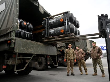 Ukrainian servicemen load a truck with the FGM-148 Javelin, American man-portable anti-tank missile provided by US to Ukraine as part of a military support, upon its delivery at Kyiv's airport Boryspil on February 11,2022, amid the crisis linked with the threat of Russia's invasion. (Photo by Sergei SUPINSKY / AFP) …