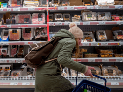 A customer shops for meat at a Sainsbury's supermarket in Walthamstow, east London on February 13, 2022. - UK annual inflation struck 5.4 percent in December, stoking fears of a cost-of-living squeeze as wages fail to keep pace. (Photo by Tolga Akmen / AFP) (Photo by TOLGA AKMEN/AFP via Getty …