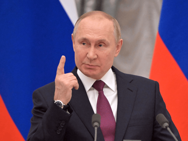 Russian President Vladimir Putin speaks during a joint press conference with German Chancellor following their meeting over Ukraine security at the Kremlin, in Moscow, on February 15, 2022. - The Kremlin, earlier on February 15, 2022, confirmed a pullback of some Russian forces from Ukraine's borders but said the move …