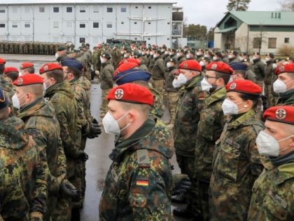 Soldiers of the German armed forces Bundeswehr take part in a ceremony during the visit of