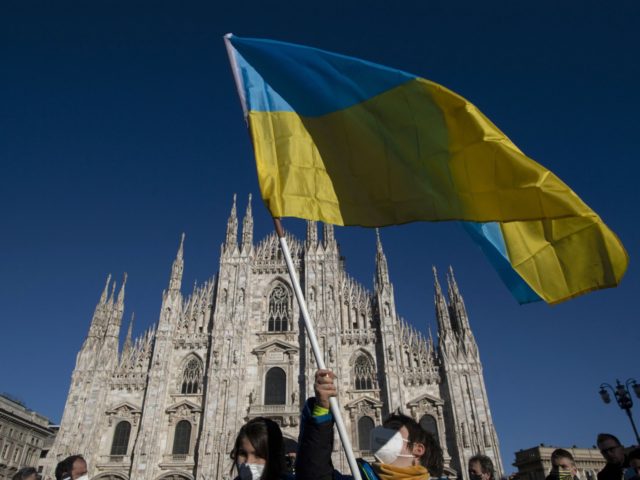 A person waves the Ukrainian flag during a demonstration against Russia's invasion of