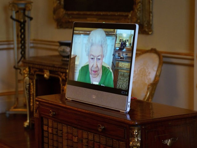 WINDSOR, ENGLAND - MARCH 01: Queen Elizabeth II appears on a screen via videolink from Win