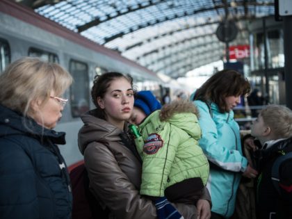 BERLIN, GERMANY - MARCH 09: People fleeing war-torn Ukraine arrive on a train from Poland at the city's Hauptbahnhof main railway station on March 9, 2022 in Berlin, Germany. City officials are taking steps to create an infrastructure for receiving the refugees, who are mostly arriving by train via Poland …