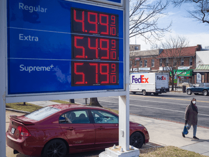 The sign shows gas prices outside a gas station in Washington DC on March 10, 2022. - Gas