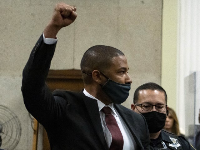 Actor Jussie Smollett is led out of the courtroom after being sentenced at the Leighton Criminal Court Building on March 10, 2022 in Chicago, Illinois. Jussie Smollett was found guilty late last year of lying to police about a hate crime after he reported to police that two masked men physically attacked him, yelling racist and anti-gay remarks near his Chicago home in 2019. He was sentenced to 150 days in jail, 30 months probation, ordered to pay $120,000 restitution to the city of Chicago and fined $25,000. (Photo by Brian Cassella-Pool/Getty Images)