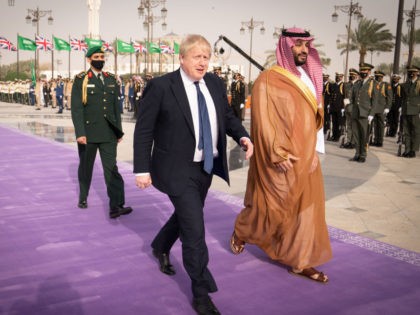 RIYADH, SAUDI ARABIA - MARCH 16: Prime Minister Boris Johnson (L) is welcomed by Mohammed bin Salman, Crown Prince of Saudi Arabia, ahead of a meeting at the Royal Court on March 16, 2022 in Riyadh, Saudi Arabia. Boris Johnson’s visit to the Middle East comes amid rocketing oil prices …