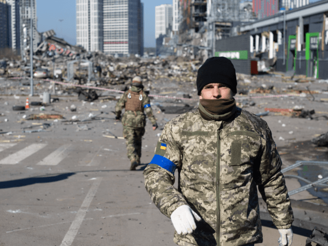 KYIV, UKRAINE - MARCH 21: Ukrainian servicemen are seen at the explosion site as a result