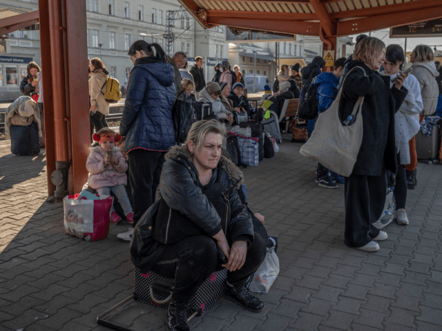Ukrainian evacuees wait to board trains at the rail station in Przemysl, near the Polish-Ukrainian border, on March 22, 2022, following Russia's military invasion launched on Ukraine. - The UN says almost 3,6 million people have fled Ukraine since the Russian invasion, with more than two million of them heading …