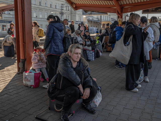 Ukrainian evacuees wait to board trains at the rail station in Przemysl, near the Polish-U