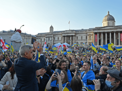Mayor of London Sadiq Khan (L) applauds people gathered in Trafalgar Square to listen to speakers following a 'London stands with Ukraine' protest march and vigil, in central London on March 26, 2022. - The month of war has displaced 4.3 million children - more than half of Ukraine's estimated …
