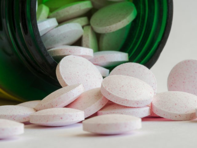 Melatonin Tablets Spilled from a Bottle