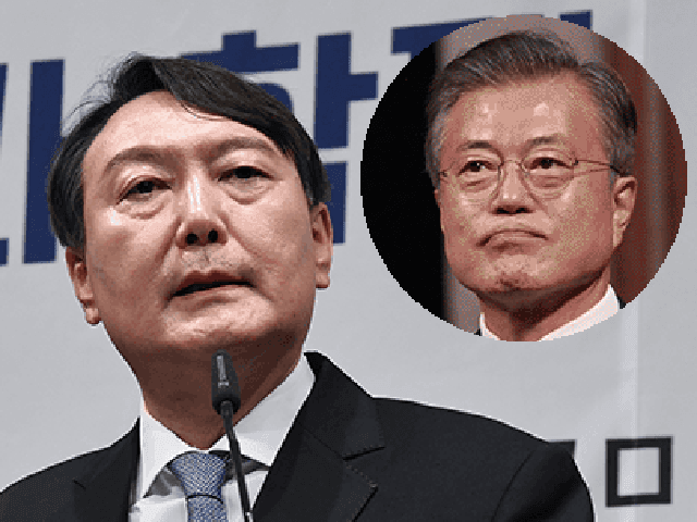 Conservative South Korean President-elect Yoon Suk-yeol and outgoing South Korean Presiden