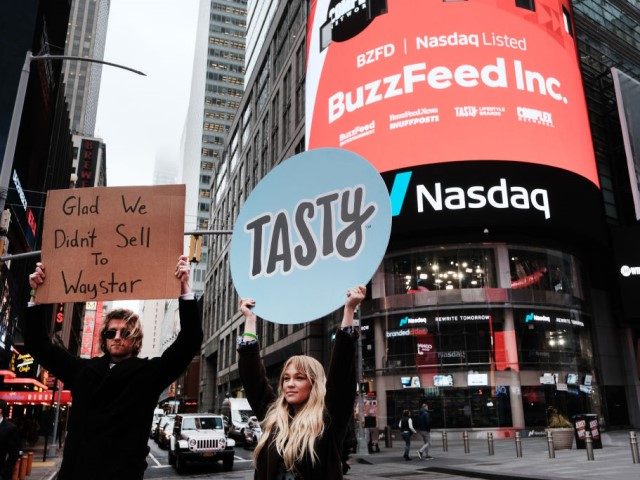 NEW YORK, NEW YORK - DECEMBER 06: Employees of the media company BuzzFeed gather in front