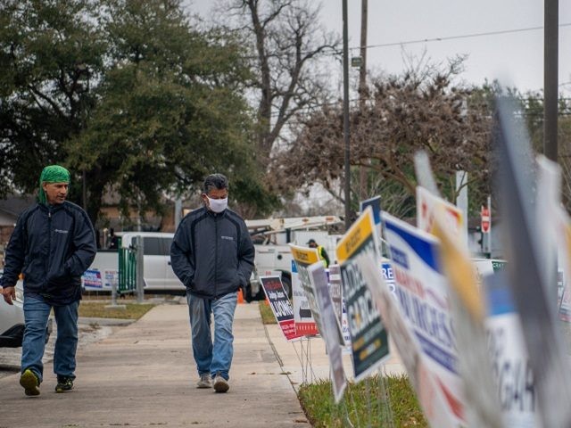 HOUSTON, TEXAS - FEBRUARY 24: People walk to cast their ballot at the Moody Community Center on February 24, 2022 in Houston, Texas. People across the Houston metropolitan area continue to cast their ballots during early primary voting. (Photo by Brandon Bell/Getty Images)