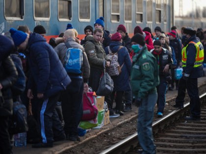 ZAHONY, HUNGARY - MARCH 02: Refugees with disabilities and their carers arrive at the Hungarian border town of Zahony on a train that has come from Ukraine on March 02, 2022 in Zahony, Hungary. Refugees from Ukraine have fled into neighbouring countries such as Hungary, forming long queues at border …