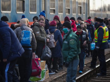 AHONY, HUNGARY - MARCH 02: Refugees with disabilities and their carers arrive at the Hungarian border town of Zahony on a train that has come from Ukraine on March 02, 2022 in Zahony, Hungary. Refugees from Ukraine have fled into neighbouring countries such as Hungary, forming long queues at border …