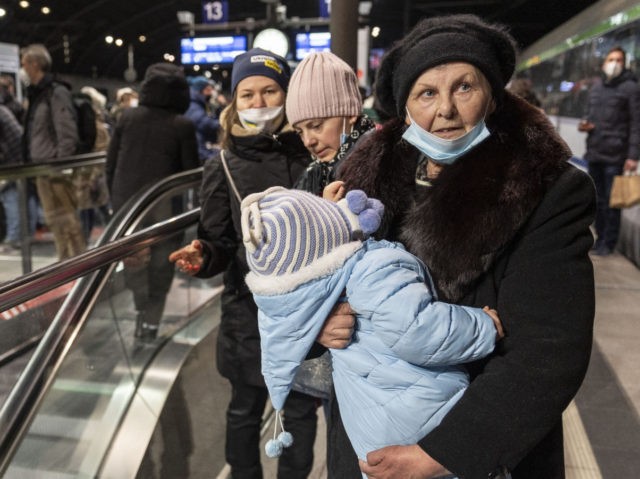 BERLIN, GERMANY - MARCH 04: People fleeing Ukraine arrive from Poland at Hauptbahnhof main railway station on March 4, 2022 in Berlin, Germany. Hundreds of thousands of people, mainly Ukrainian women and children as well as foreigners living or working in Ukraine, have fled the country as the current Russian …