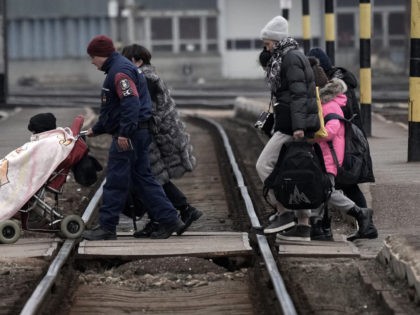 ZAHONY, HUNGARY - MARCH 07: Refugees fleeing Ukraine arrive at Zahony train station on Mar