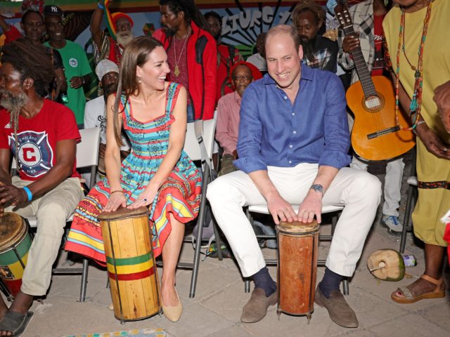 KINGSTON, JAMAICA - MARCH 22: Prince William, Duke of Cambridge and Catherine, Duchess of Cambridge play the drums during a visit to Trench Town Culture Yard Museum where Bob Marley used to live, on day four of the Platinum Jubilee Royal Tour of the Caribbean on March 22, 2022 in …