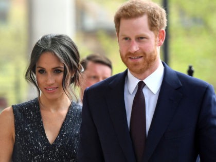 Britain's Prince Harry (R) and his US fiancee Meghan Markle arrive to attend a memorial service at St Martin-in-the-Fields in Trafalgar Square in London, on April 23, 2018, to commemorate the 25th anniversary of the murder of Stephen Lawrence. - Prince Harry will attended a memorial on Monday marking the …