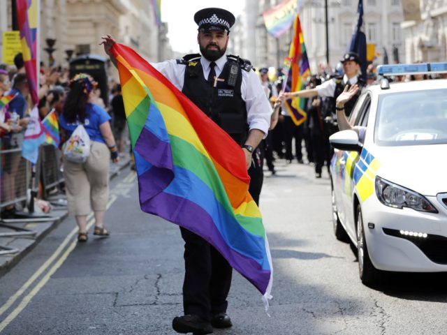 Police officers join supporters and members of the Lesbian, Gay, Bisexual and Transgender