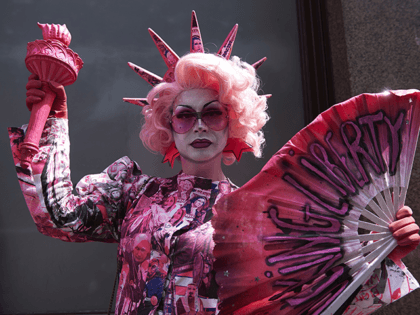 A drag queen joins protesters against the UK visit of US President Donald Trump as they gather to take part in a march and rally in London on July 13, 2018. - US President Donald Trump launched an extraordinary attack on Prime Minister Theresa May's Brexit strategy, plunging the transatlantic …