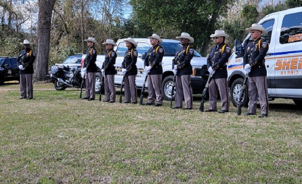 A Harris County Sheriff's Office Honor Guard stands by to salute Deputy Neil Adams. (Bob Price/Breitbart Texas)