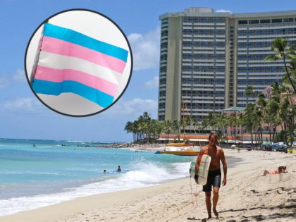 FILE - In this June 5, 2020, file photo, a surfer walks on a sparsely populated Waikiki Be