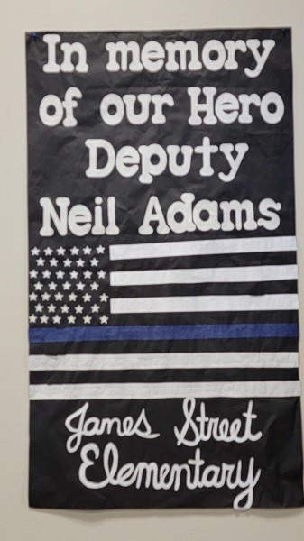 A tribute to Deputy Neil Adams from James Street Elementary School students. (Bob Price/Breitbart Texas)