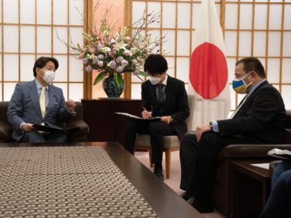 Japan’s Foreign Minister Yoshimasa Hayashi (L) talks with the Ukrainian ambassador to Japan, Sergiy Korsunsky (R), during their meeting in Tokyo on March 2, 2022.