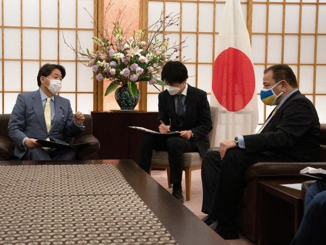 Japan’s Foreign Minister Yoshimasa Hayashi (L) talks with the Ukrainian ambassador to Ja