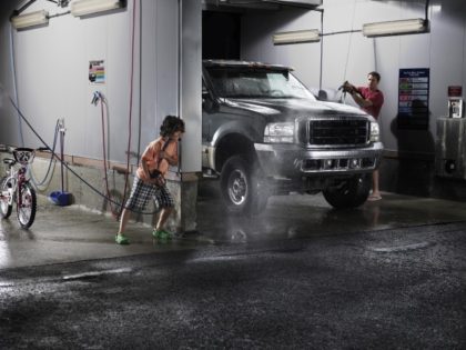 Man and boy at car wash