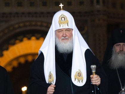 Russian Orthodox Church Patriarch Kirill, center, walks to attend the Annunciation celebrating the Annunciation, on the eve of Orthodox Easter during a live broadcast from the almost empty Christ the Savior Cathedral in Moscow, Russia, Tuesday, April 7, 2020. (AP Photo/Alexander Zemlianichenko)