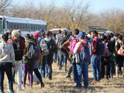 Migrants await transportation after being apprehended near the Texas border. (Randy Clark/Breitbart Texas)