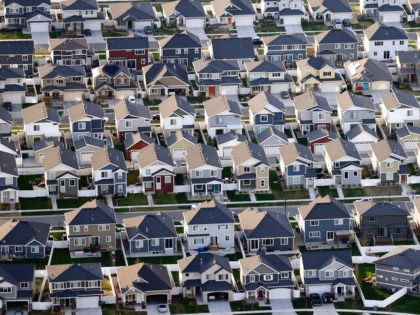 Rows of homes, are shown in suburban Salt Lake City, on April 13, 2019. (AP Photo/Rick Bow