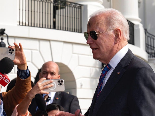 President Joe Biden speaks with reporters before boarding Marine One on the South Lawn of