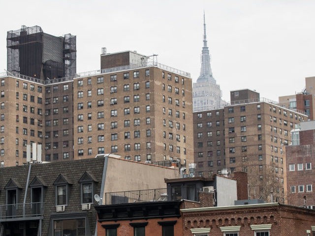 With the Empire State Building in the background, apartment buildings stand in the Chelsea