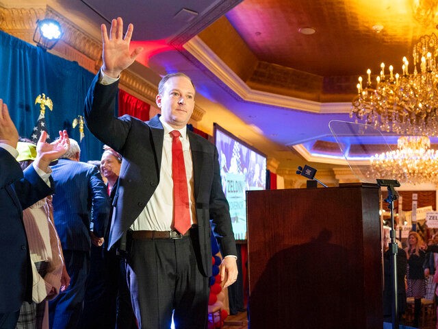 U.S. Rep. Lee Zeldin waves to supporters before speaking to delegates and assembled party