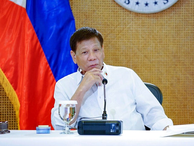In this photo provided by the Malacanang Presidential Photographers Division, Philippine President Rodrigo Duterte listens during his meeting with cabinet officials at the Malacanang presidential palace in Manila, Philippines on March 7, 2022. (King Rodriguez/Malacanang Presidential Photographers Division via AP)