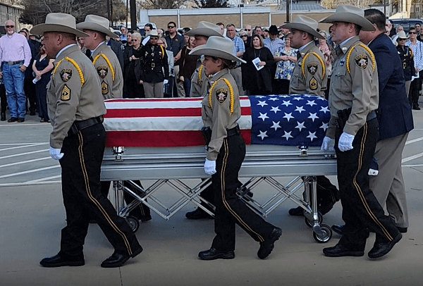 San Jacinto County Sheriff's Office Deputies carry the casket of slain Deputy Neil Adams. (Bob Price/Breitbart Texas)