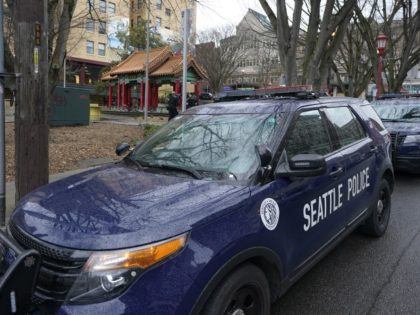 FILE - A Seattle Police vehicle sits parked at Hing Hay Park on March 18, 2021, in Seattle. Seattle's elected prosecutor is promising quicker charging decisions to help tackle persistent low-level crime that's plagued businesses downtown. City Attorney Ann Davison, a Republican who won election in November over a police …