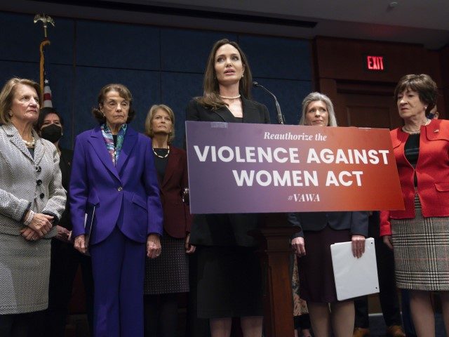 Actress and activist Angelina Jolie, center, is joined from left by Sen. Shelley Moore Cap